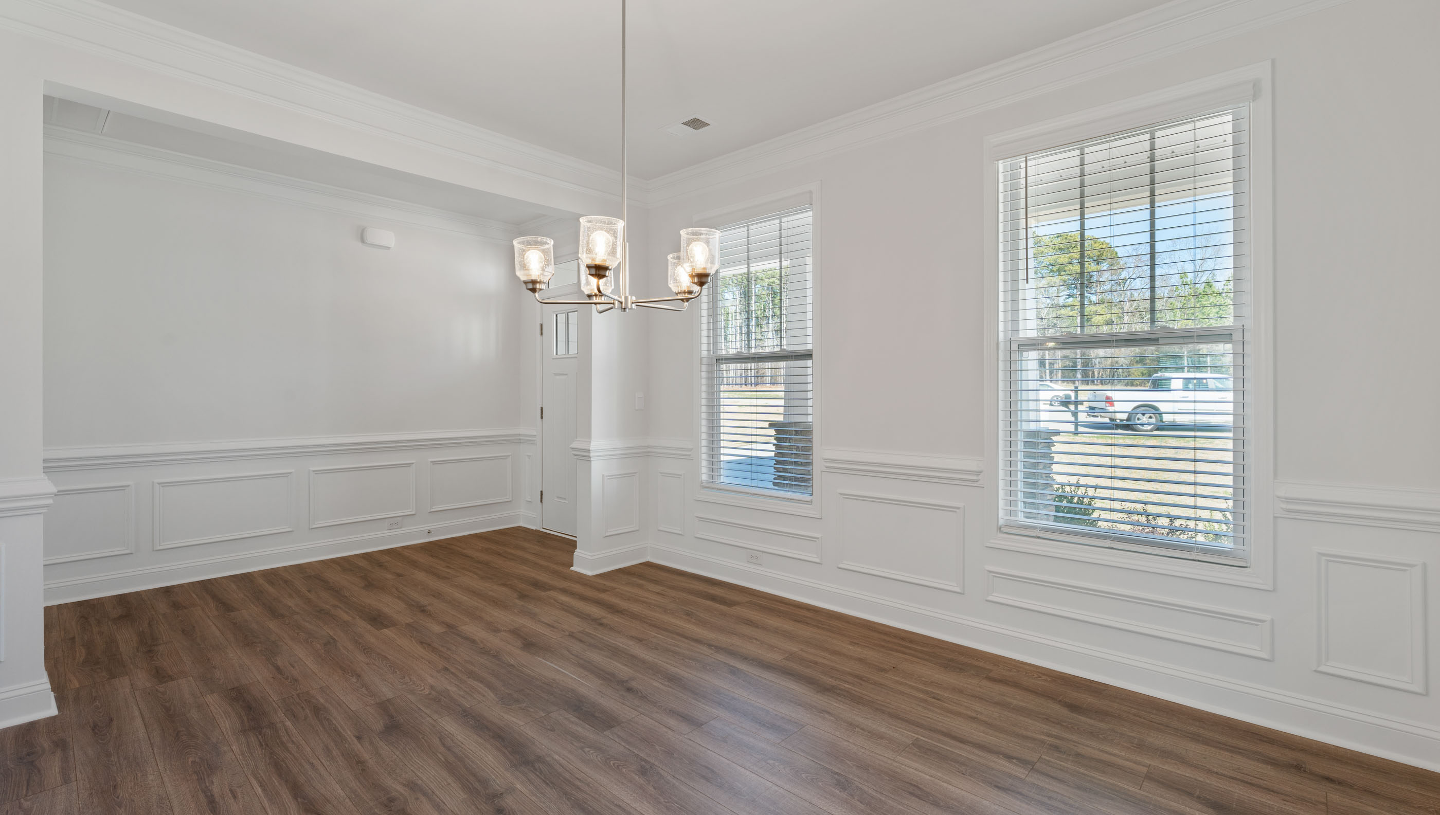 View of dining room with large window providing lots of natural light.