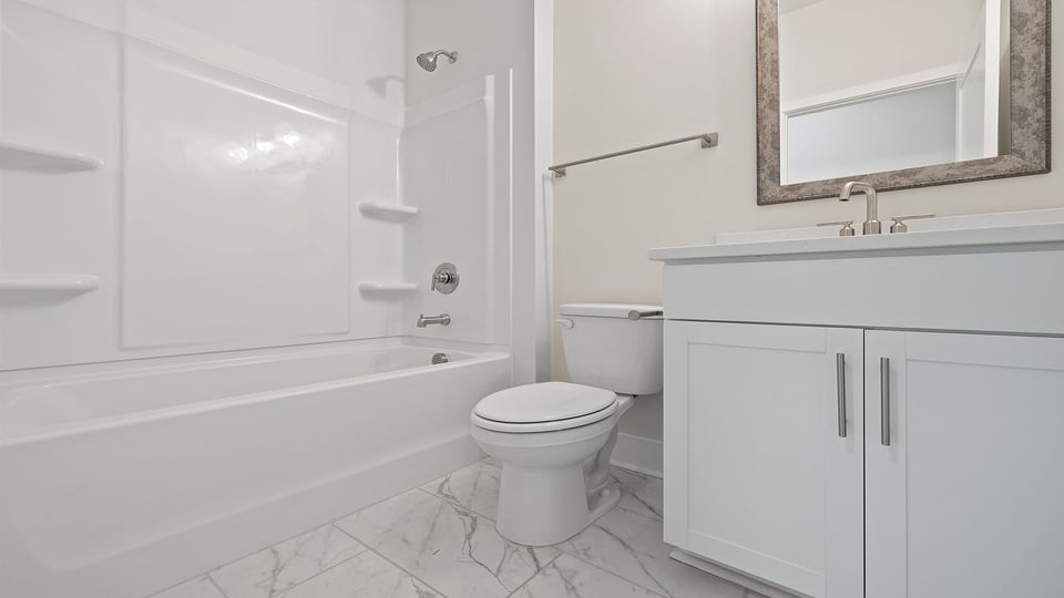 Bathroom with vanity and tub.