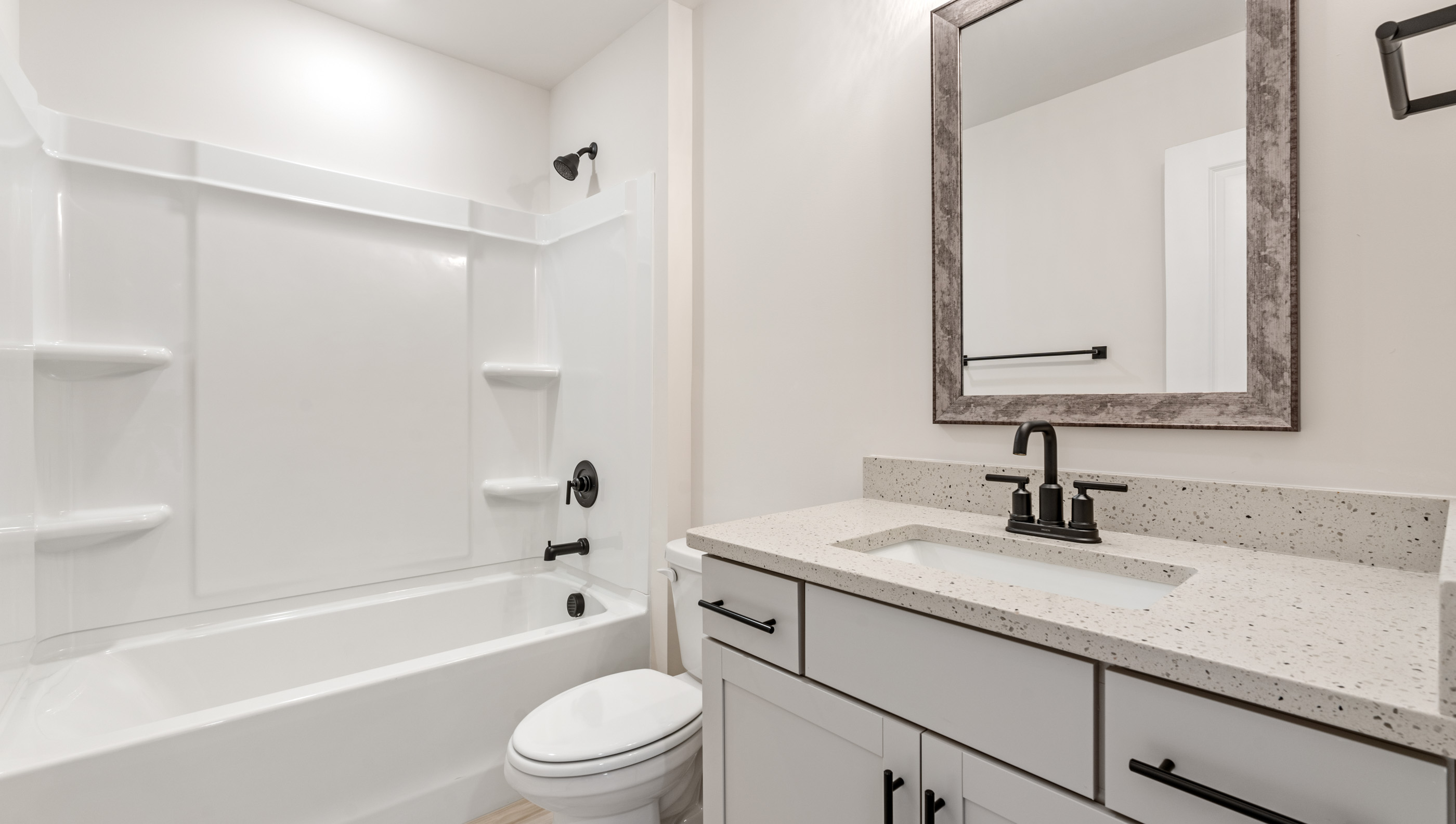 Bathroom with vanity and tub.