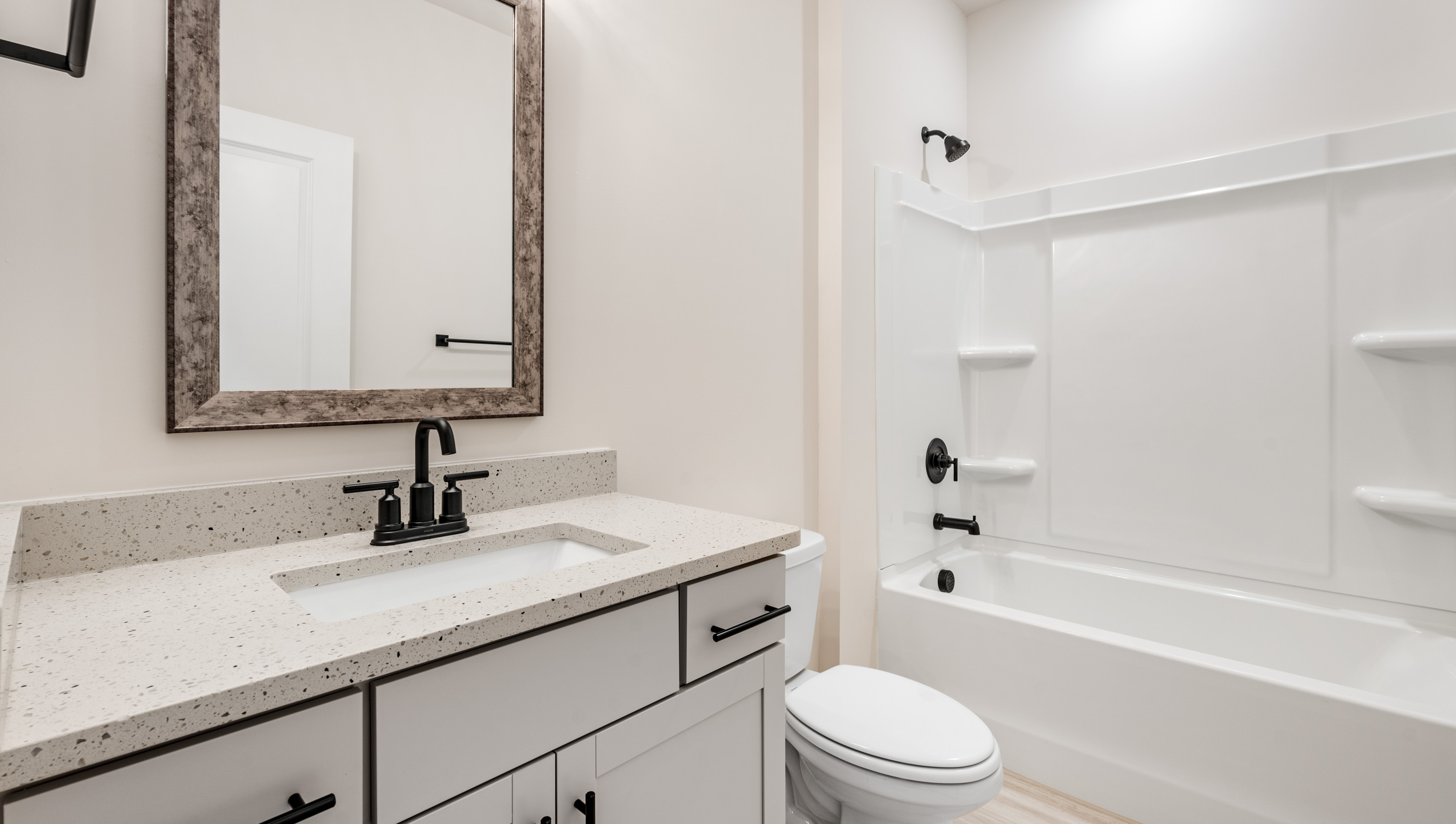 Bathroom with vanity and tub.