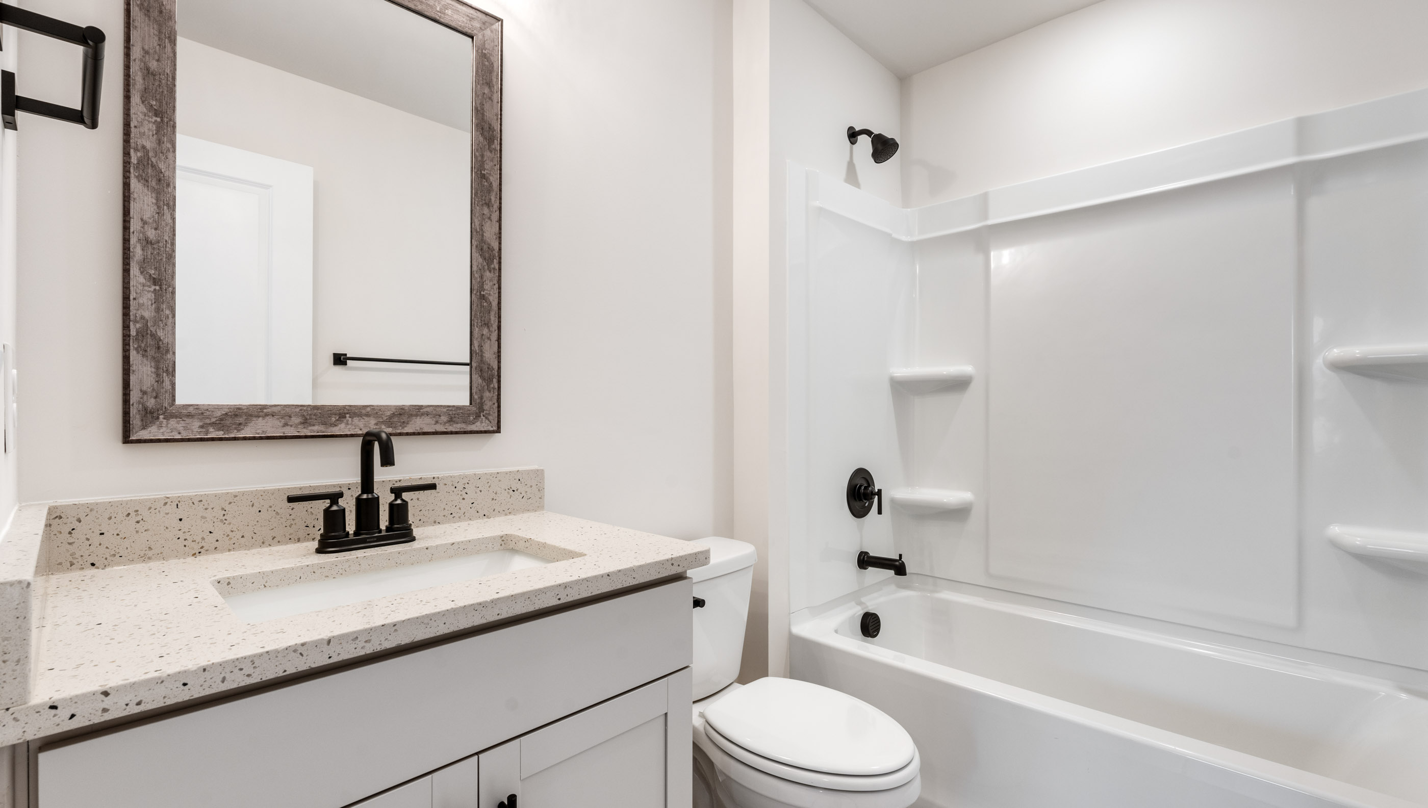 Bathroom with vanity and tub.