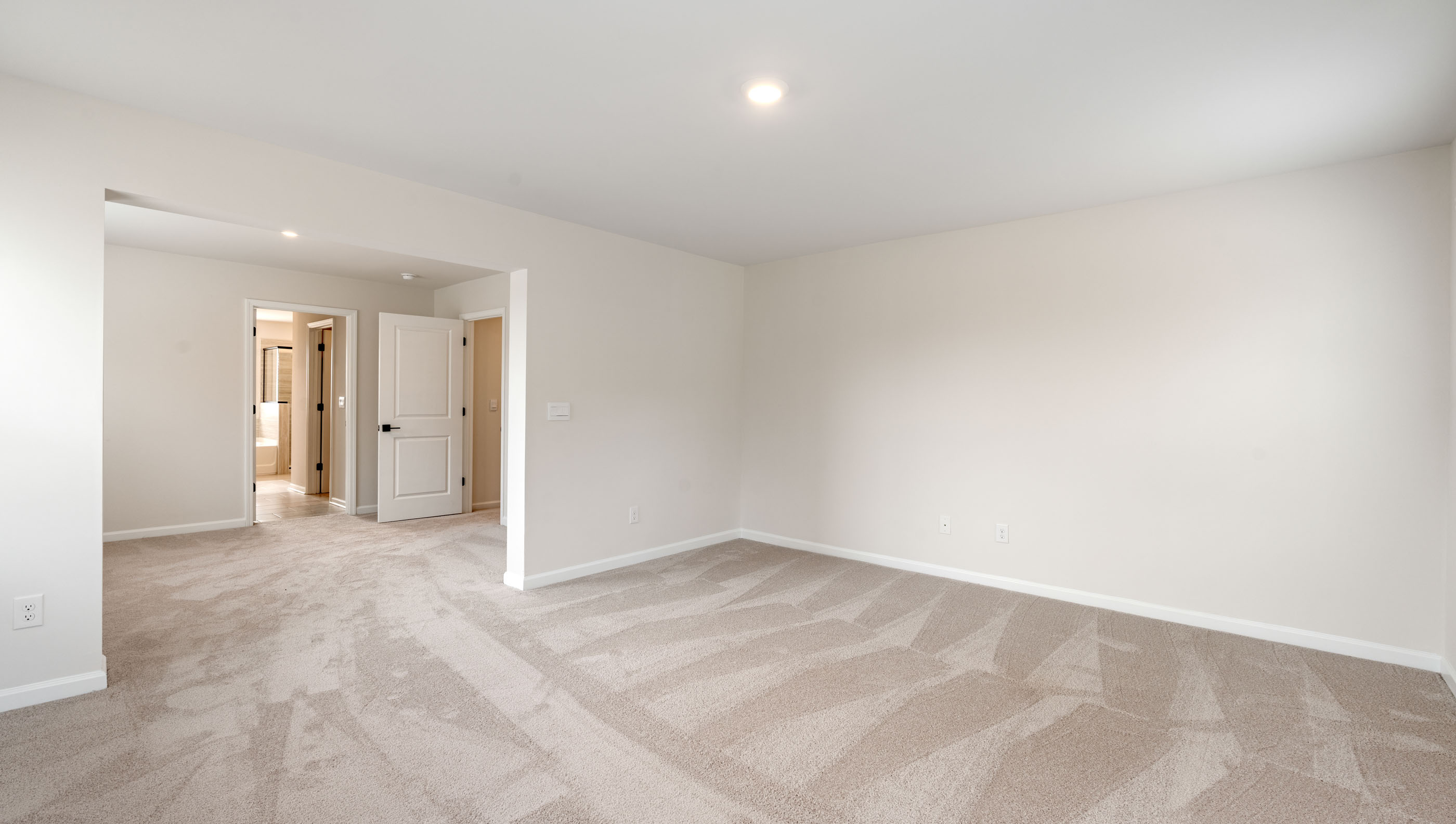 Bedroom with carpet and window.