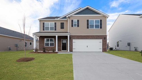 Front exterior of 2 Hayden with 2 car garage.