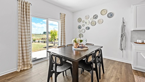 Dining room area with sliding doors to backyard.
