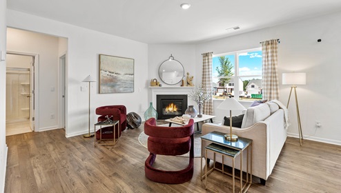 Living room with windows and fireplace.