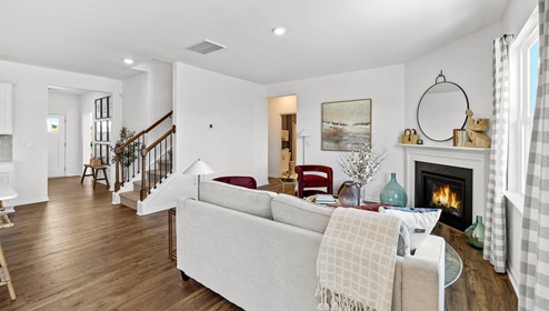 Living room with windows and fireplace.