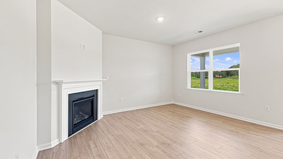 Living area with windows and fireplace.