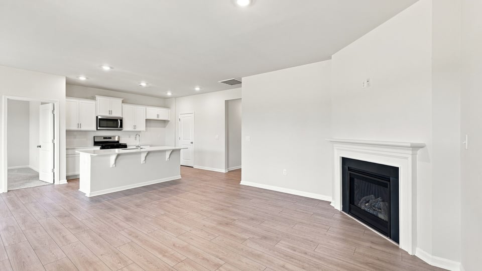 Living area with windows and fireplace.