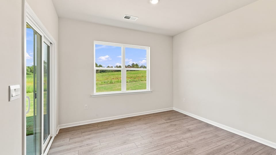 Living area with windows and fireplace.
