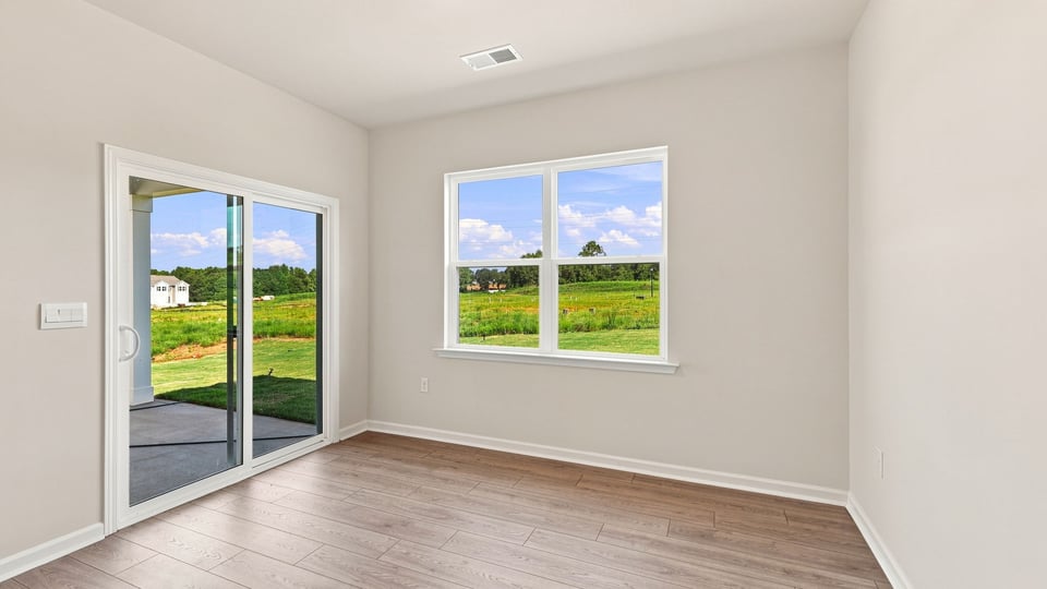 Living area with windows and fireplace.