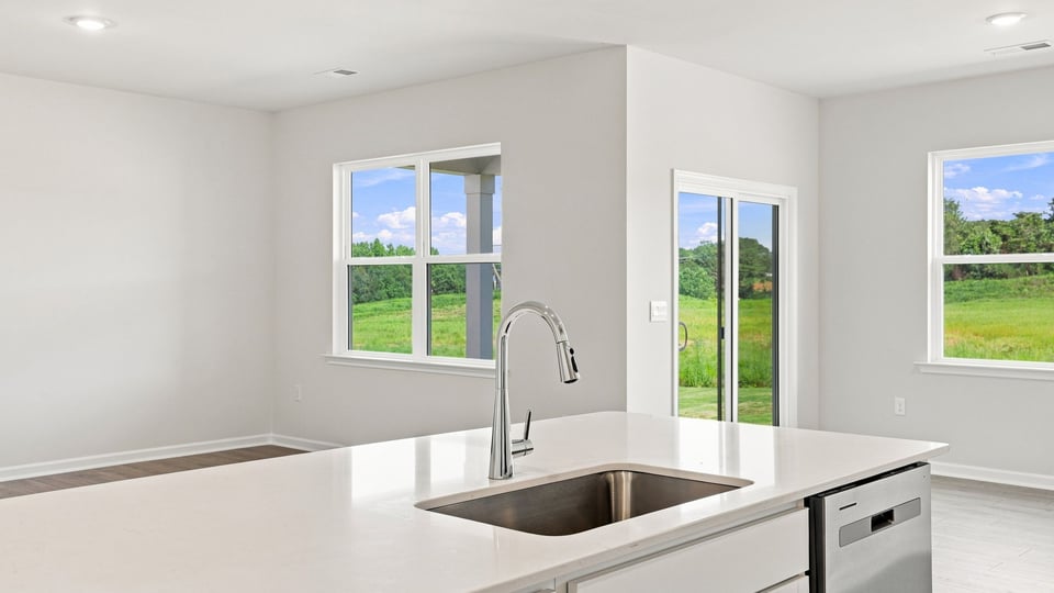 Kitchen with island and cabinets.