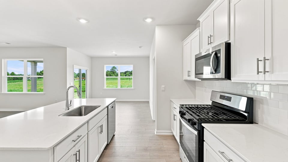 Kitchen with island and cabinets.