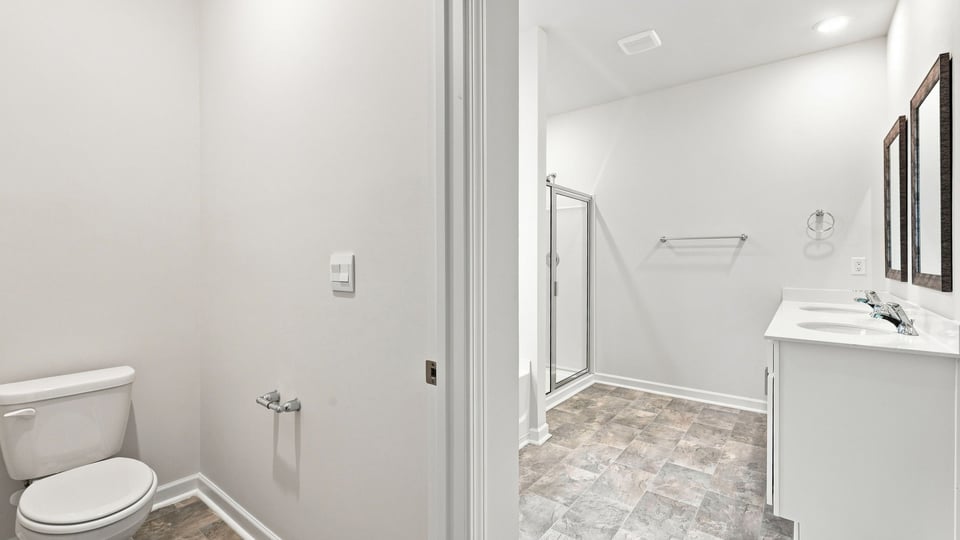 Primary bathroom with double vanity sinks.