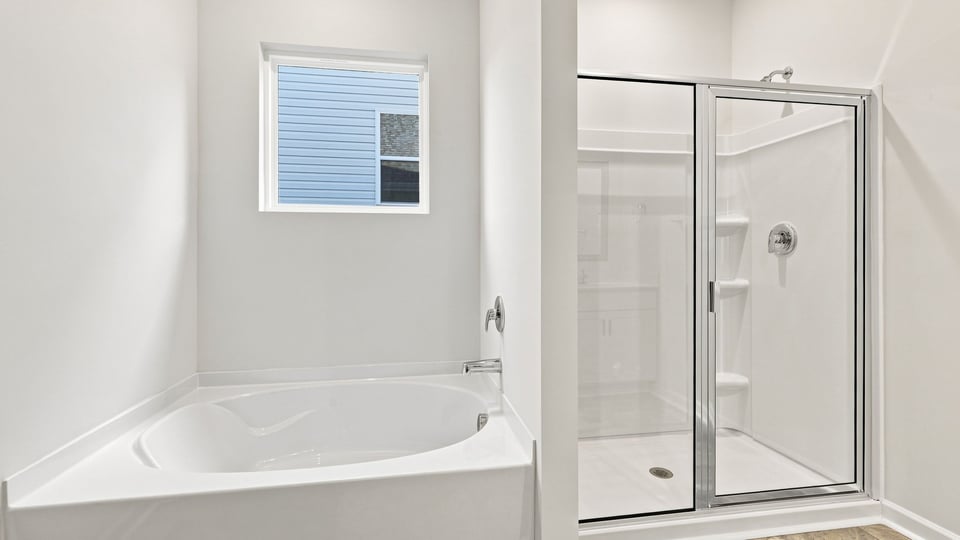 Primary bathroom with double vanity sinks.