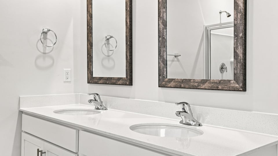 Primary bathroom with double vanity sinks.