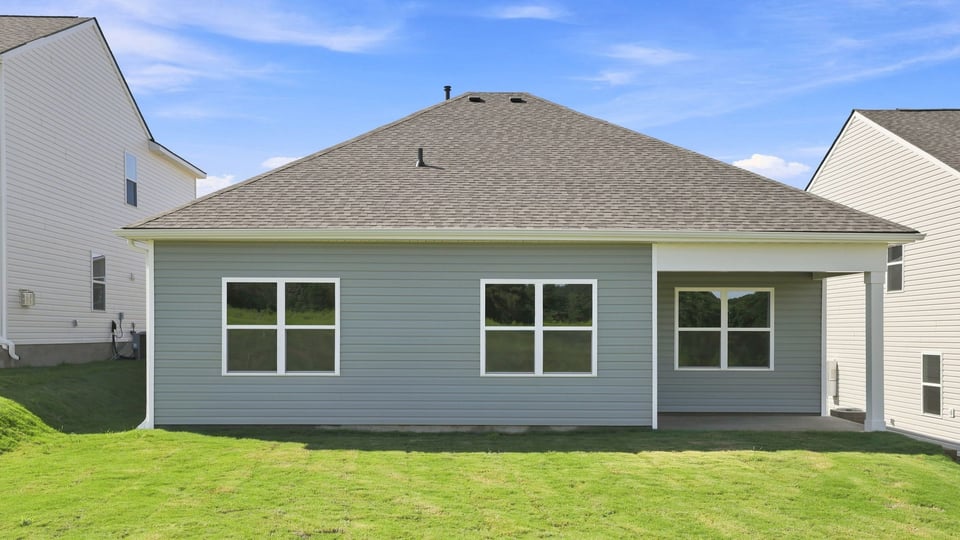 Back exterior with large backyard.