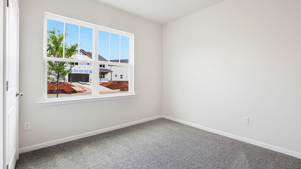 Bedroom with carpet.