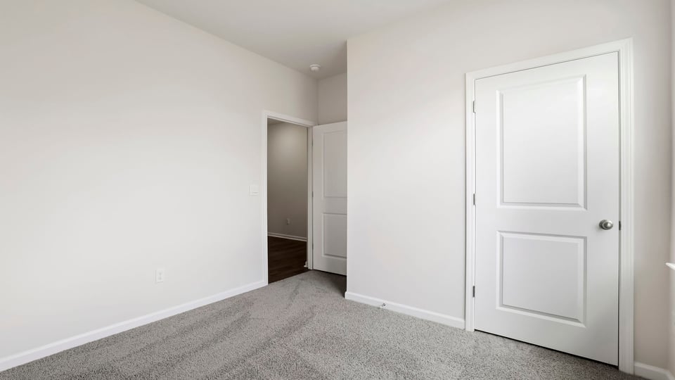 Bedroom with carpet.