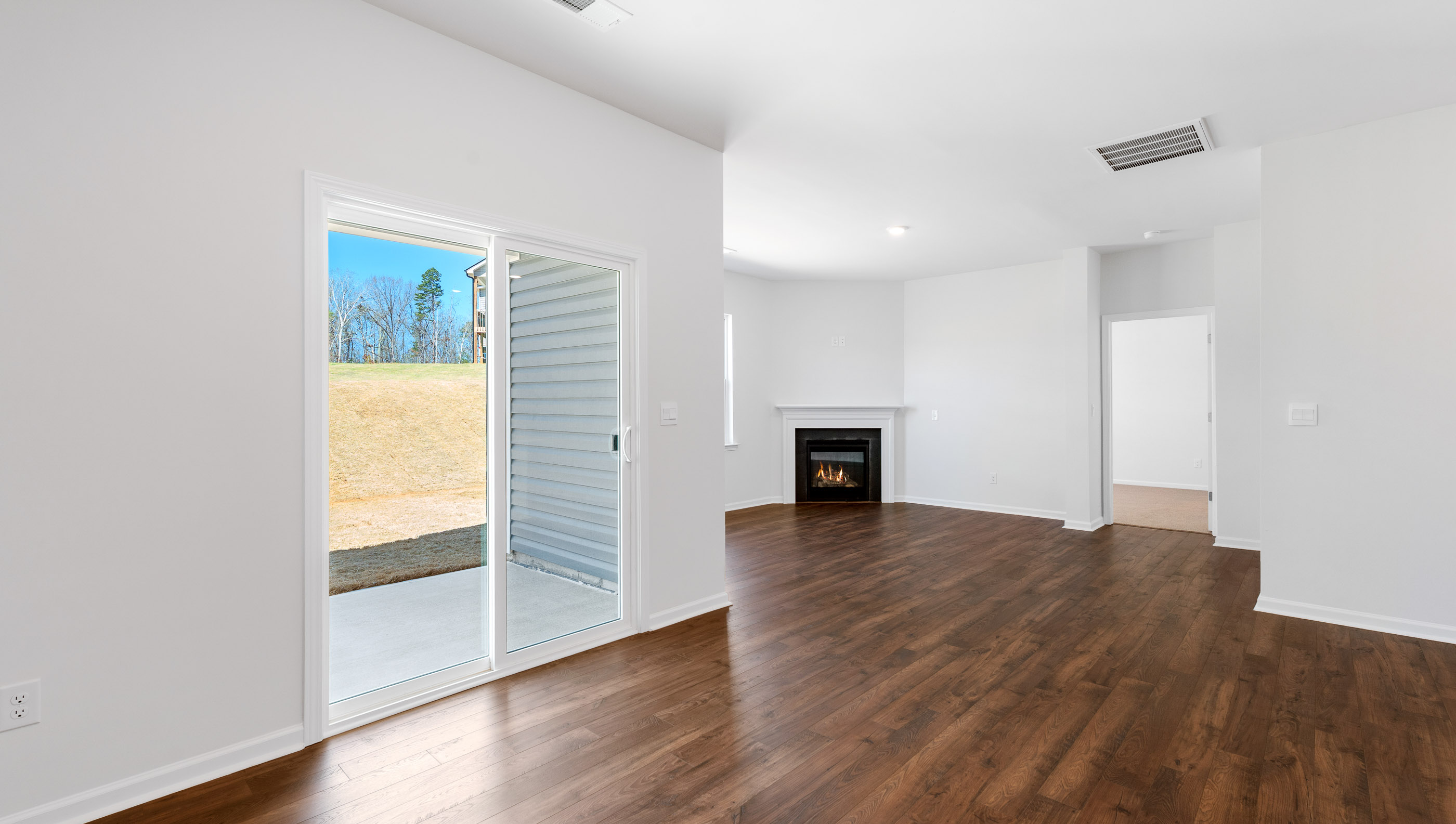 Dining room facing family room with fireplace.