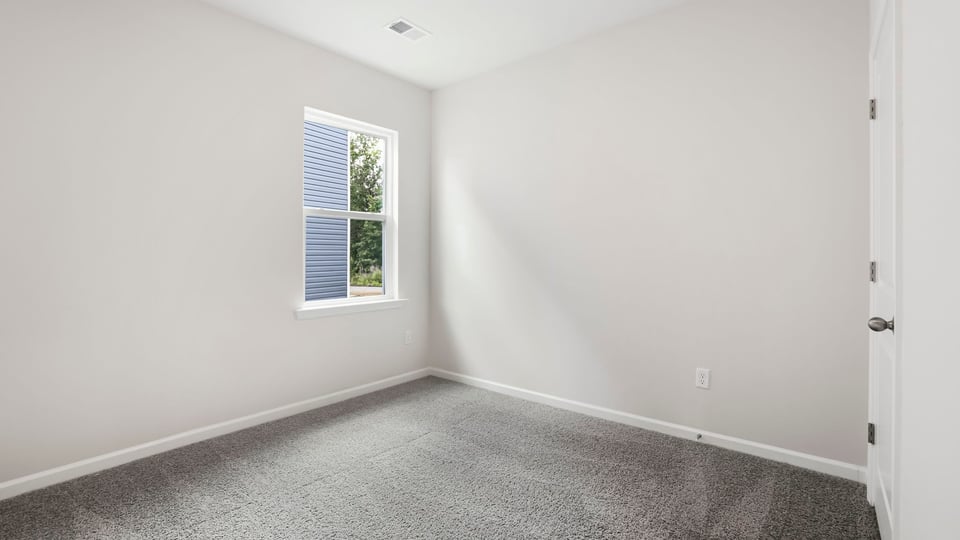 Bedroom with carpet.