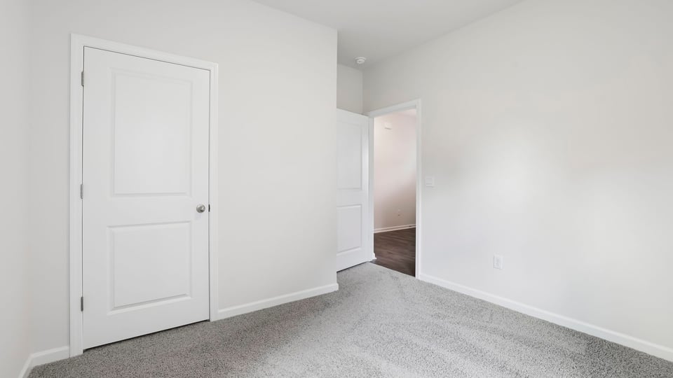 Bedroom with carpet.