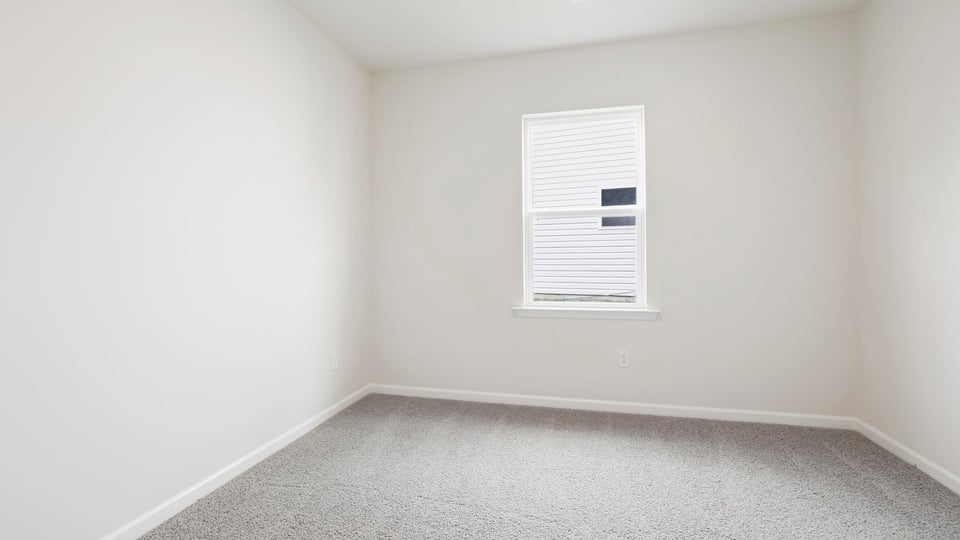 Bedroom with carpet.