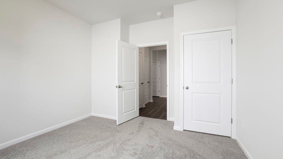 Bedroom with carpet.