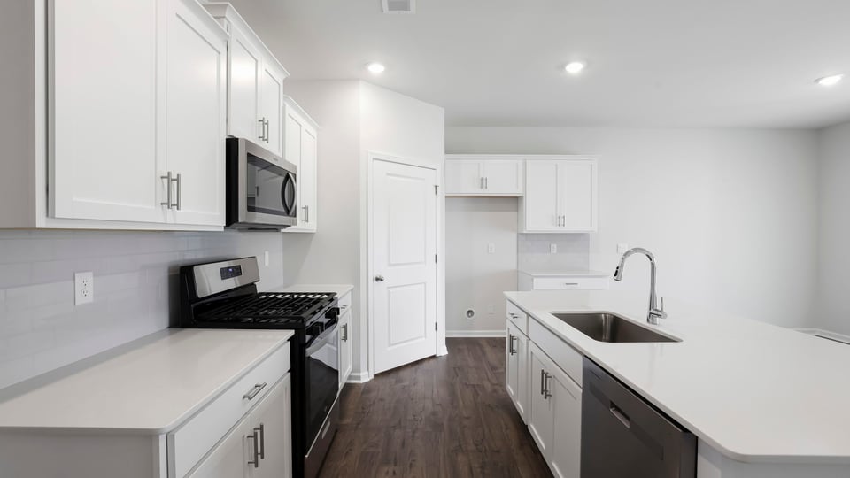 Kitchen with island and countertops.