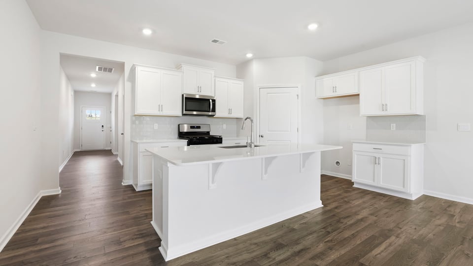 Kitchen with island and countertops.