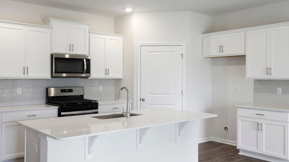 Kitchen with island and countertops.