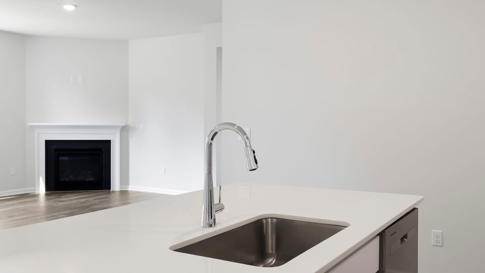Kitchen with island and countertops.