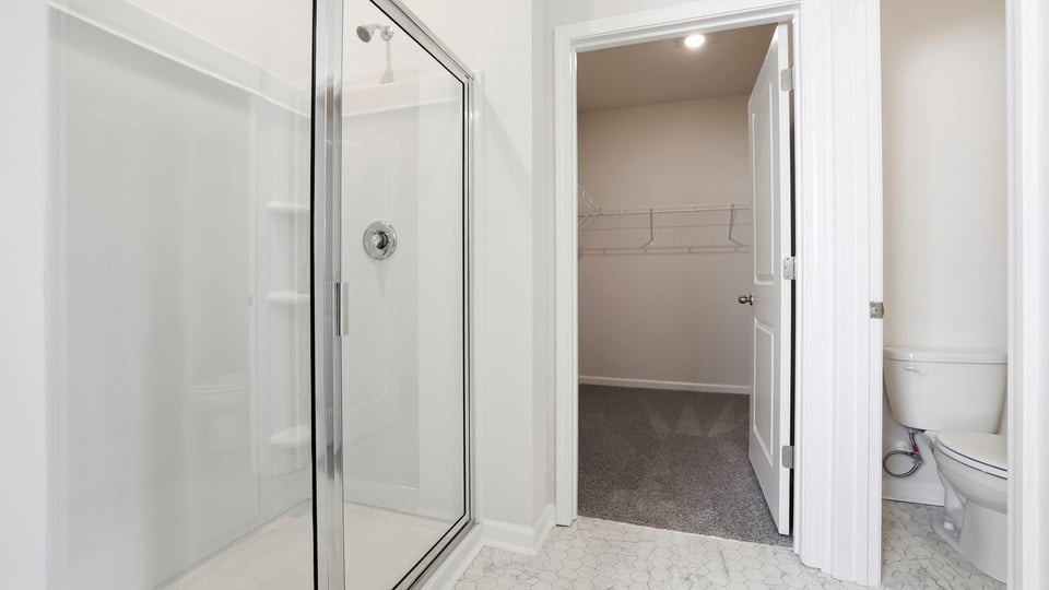 Bathroom with walk in shower and tub.