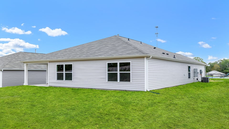 Exterior of home with backyard.