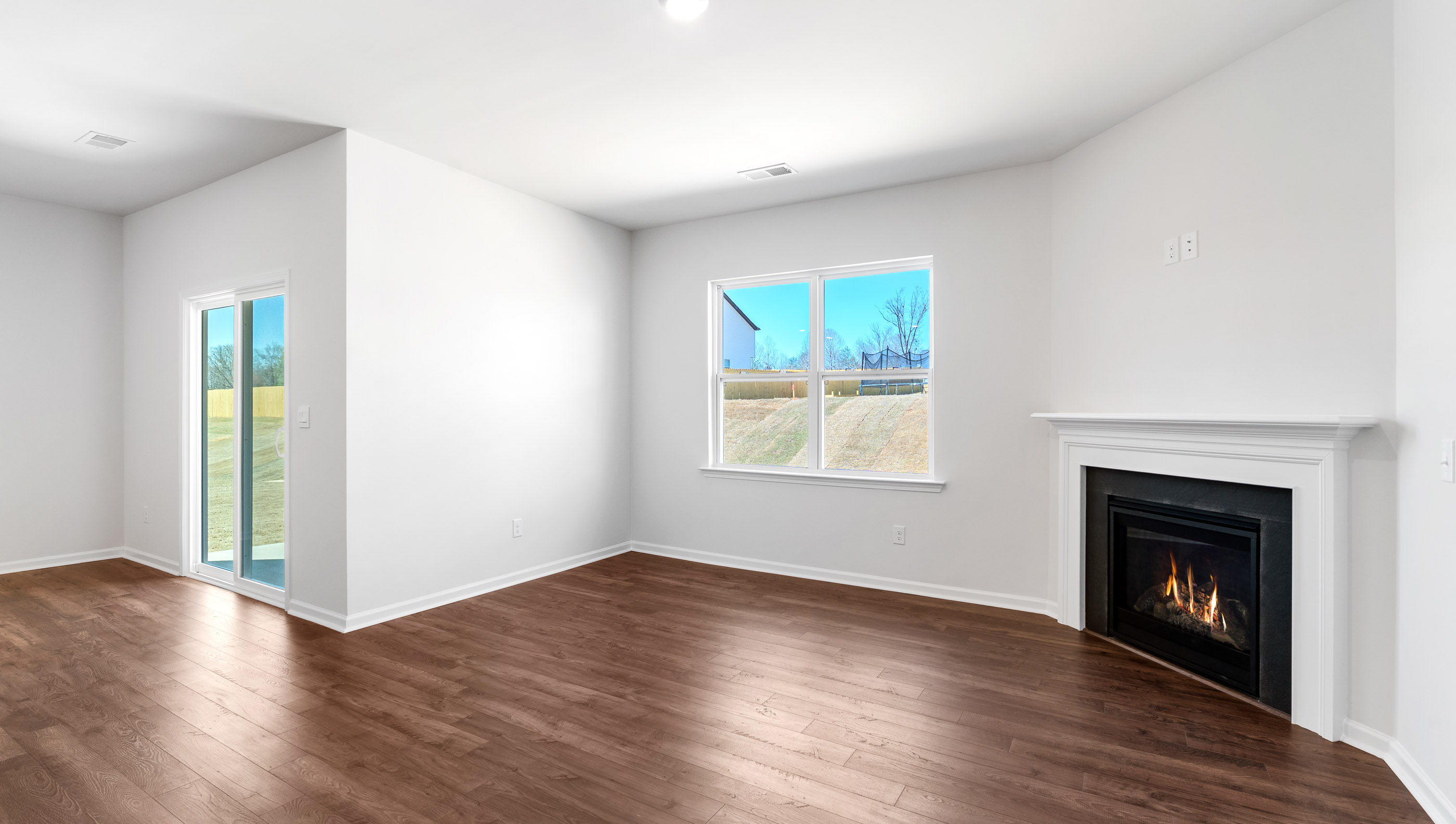 Family room with windows and fireplace.