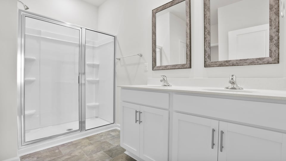 Bathroom with vanity and shower.