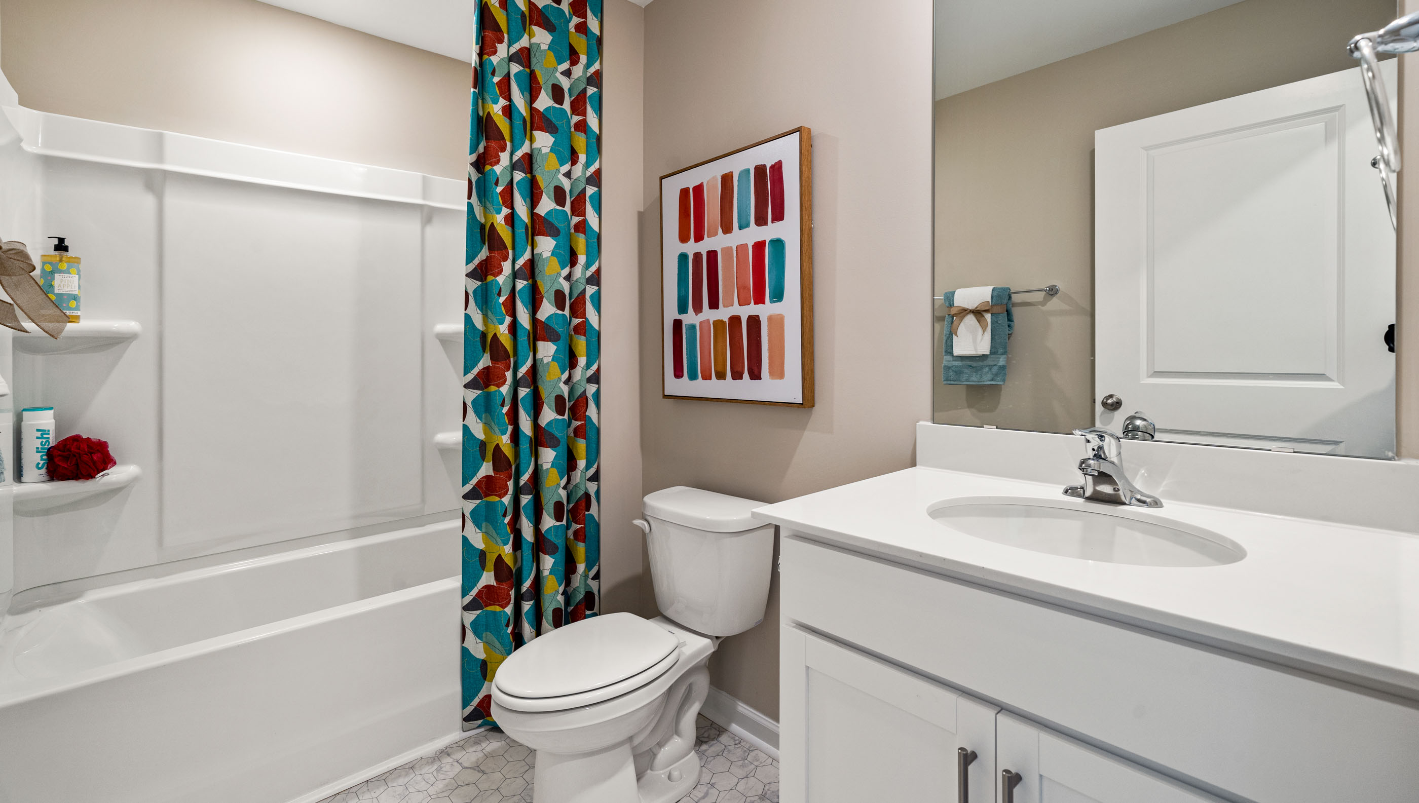 Bathroom with vanity and tub.