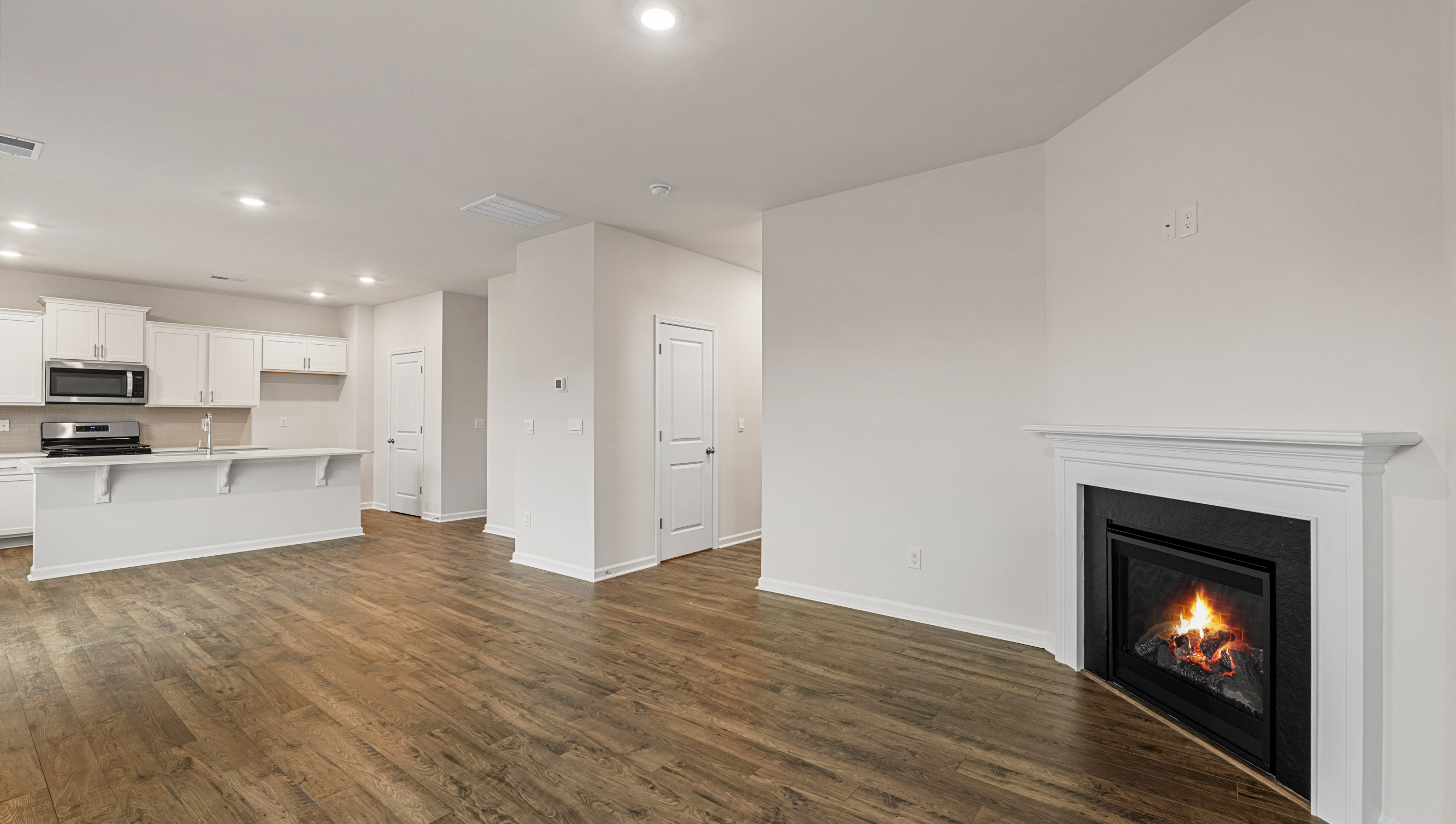 Family room with windows and fireplace.