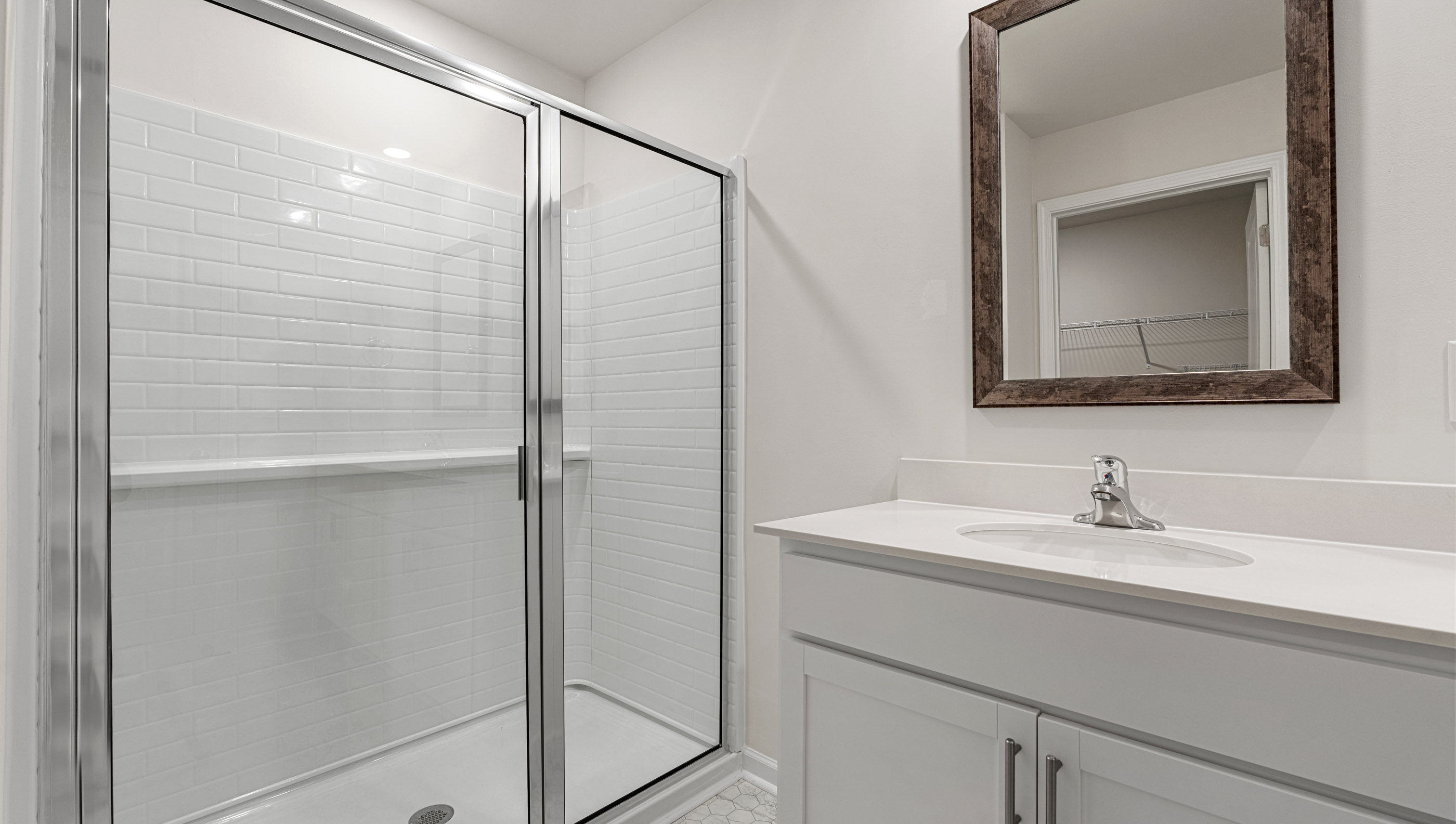 Bathroom with walk in shower.