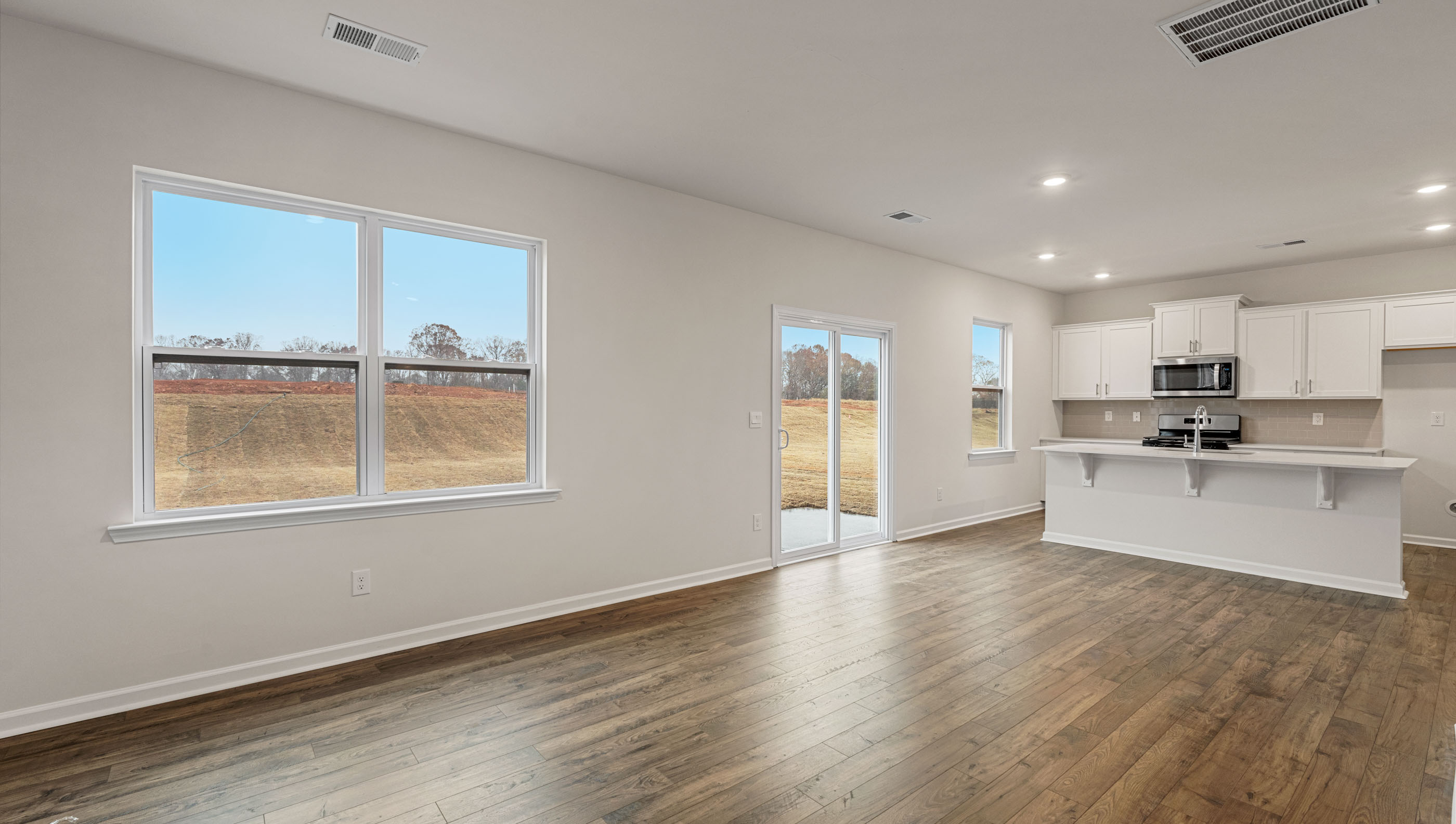 Family room with windows and fireplace.