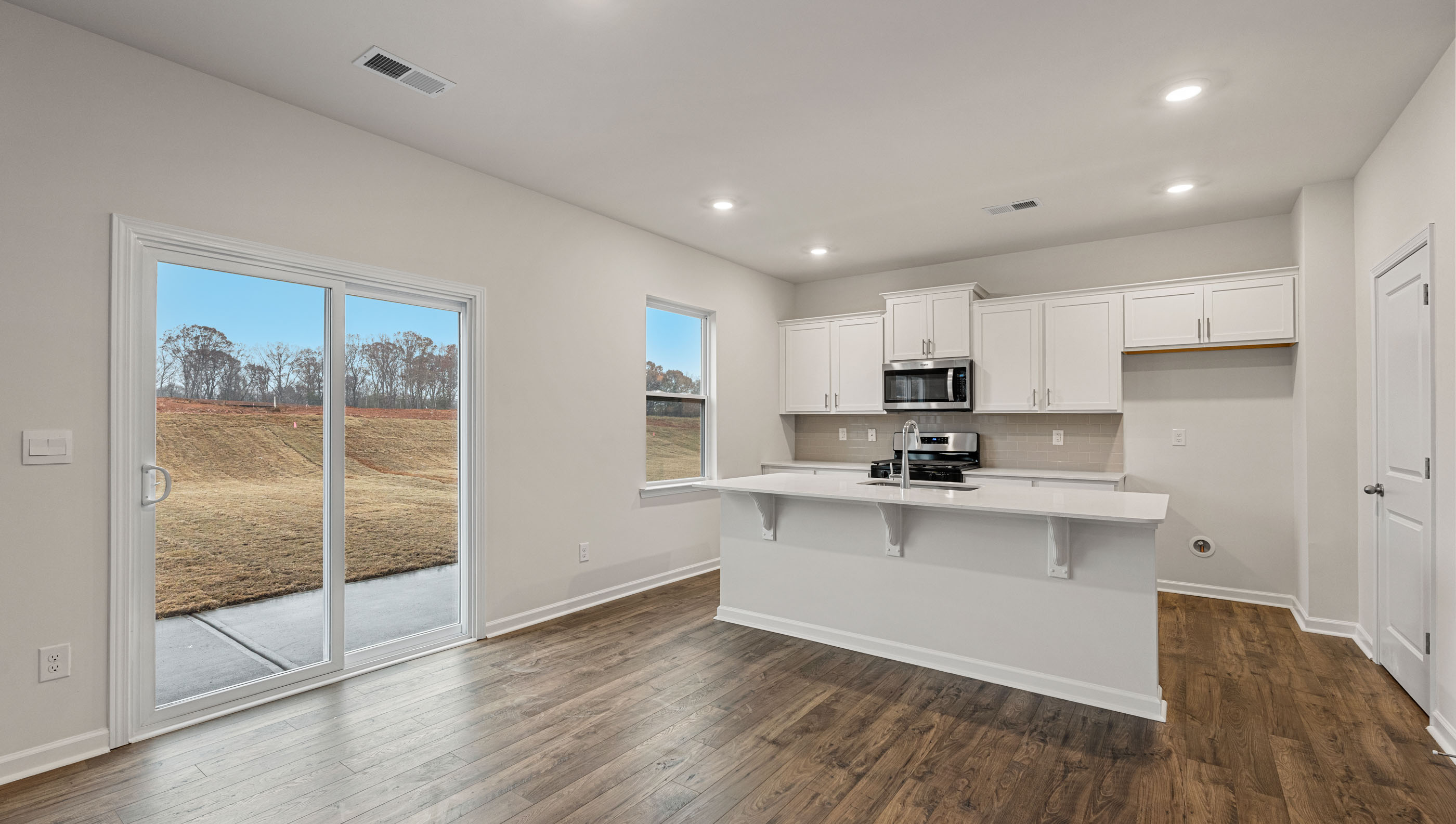 Kitchen with view of island.