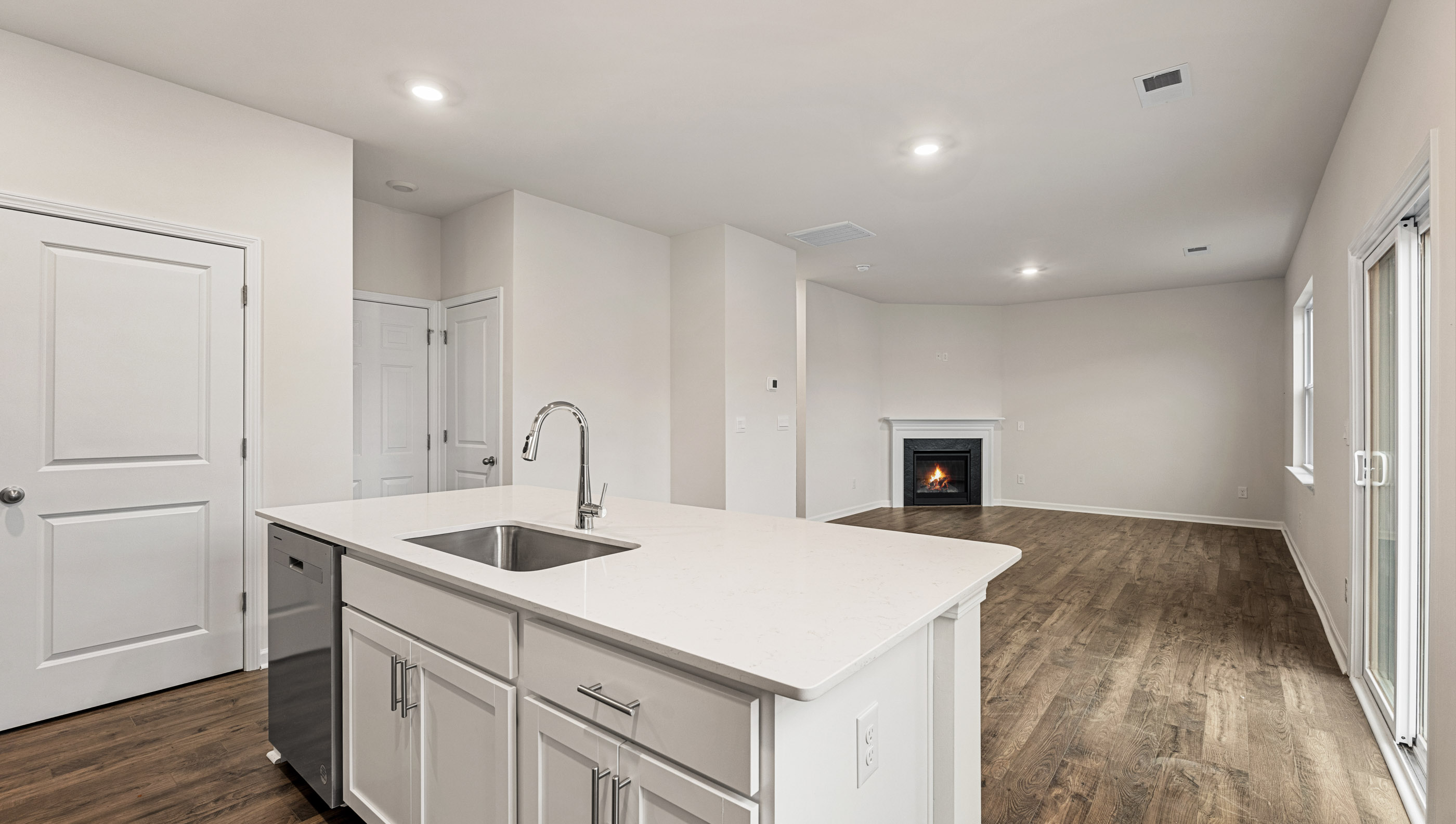 Kitchen with view of island.