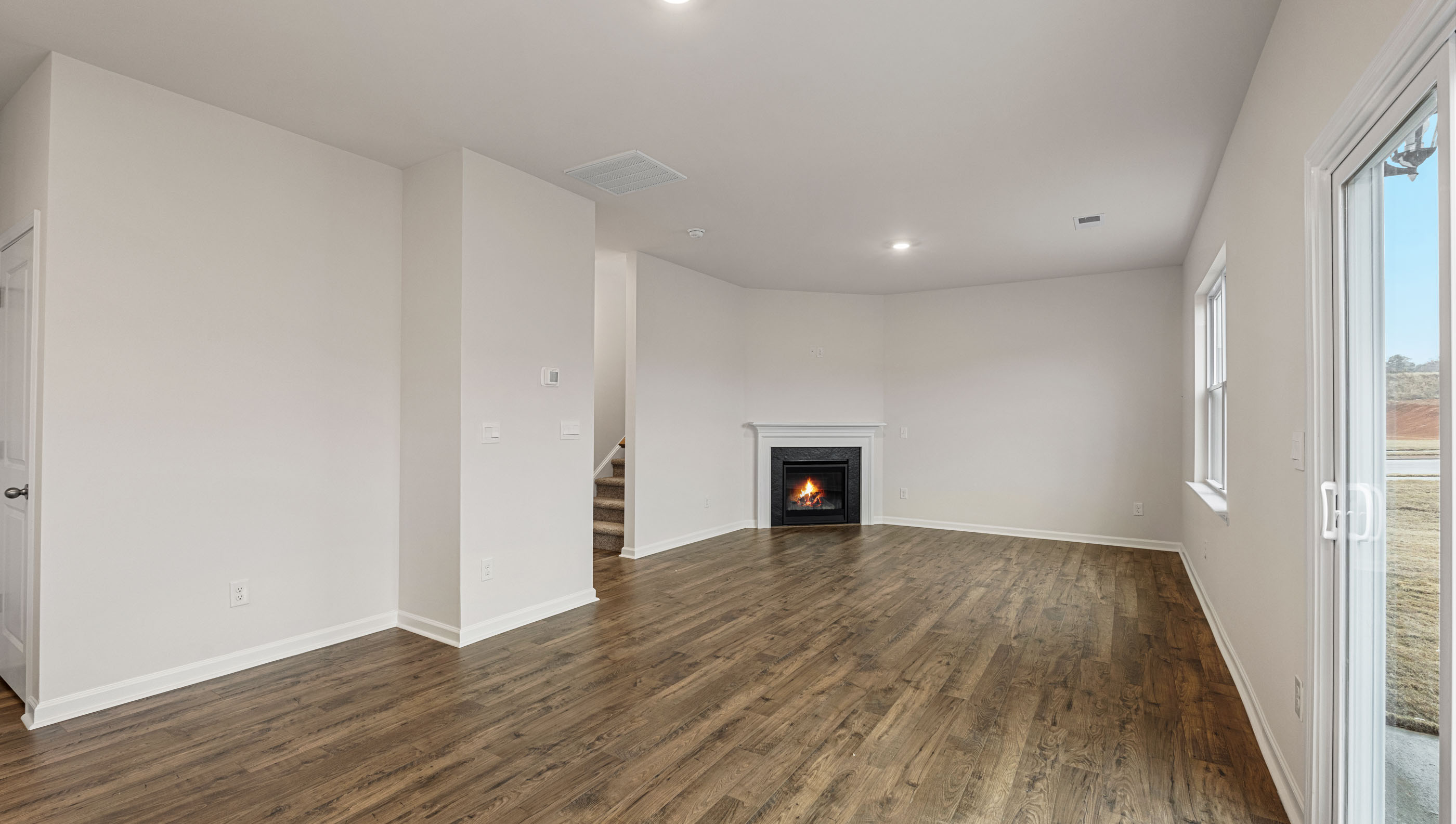 Family room with windows and fireplace.