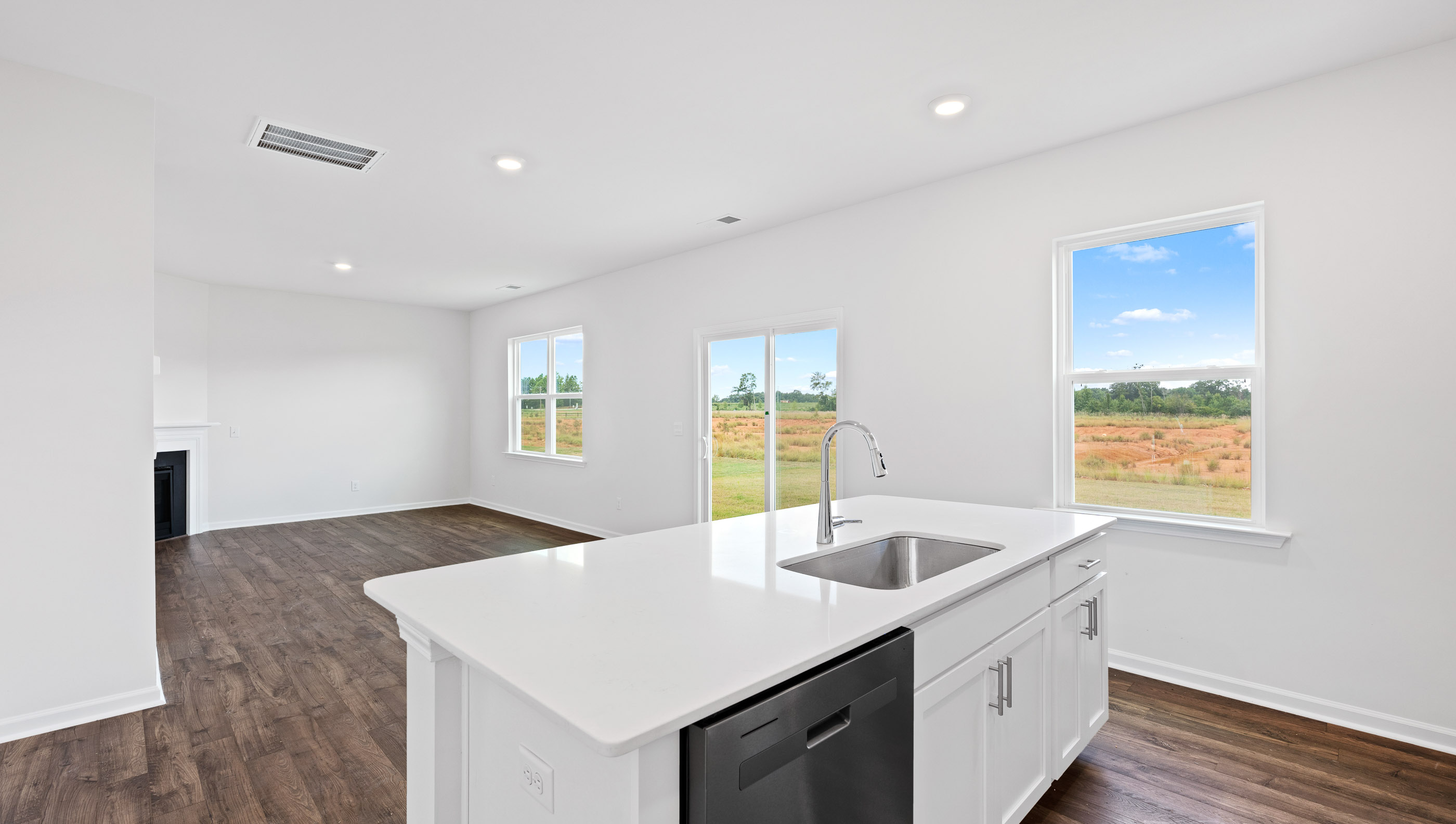 Kitchen with island and granite countertops.