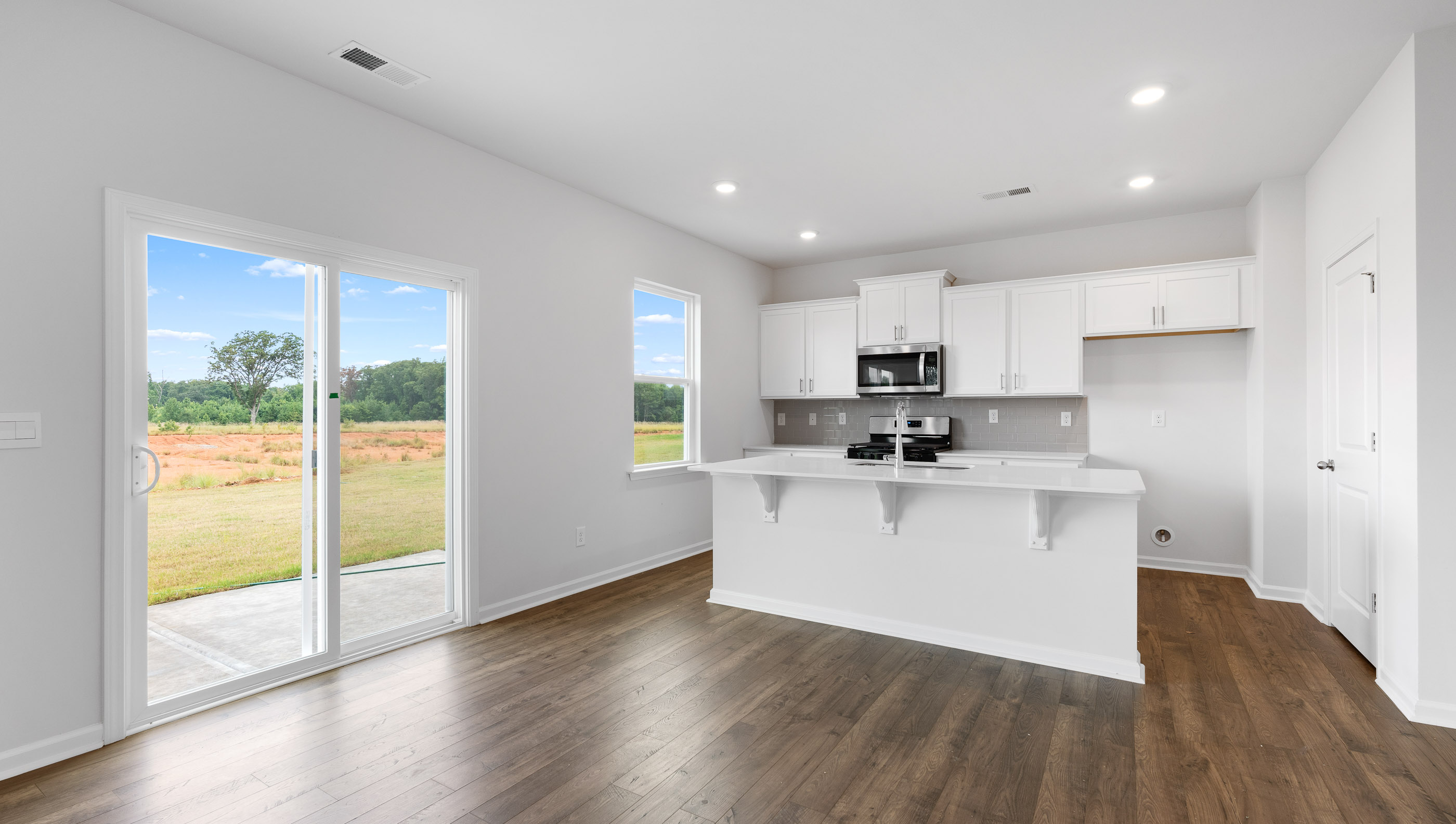 Kitchen with island and sliding doors.