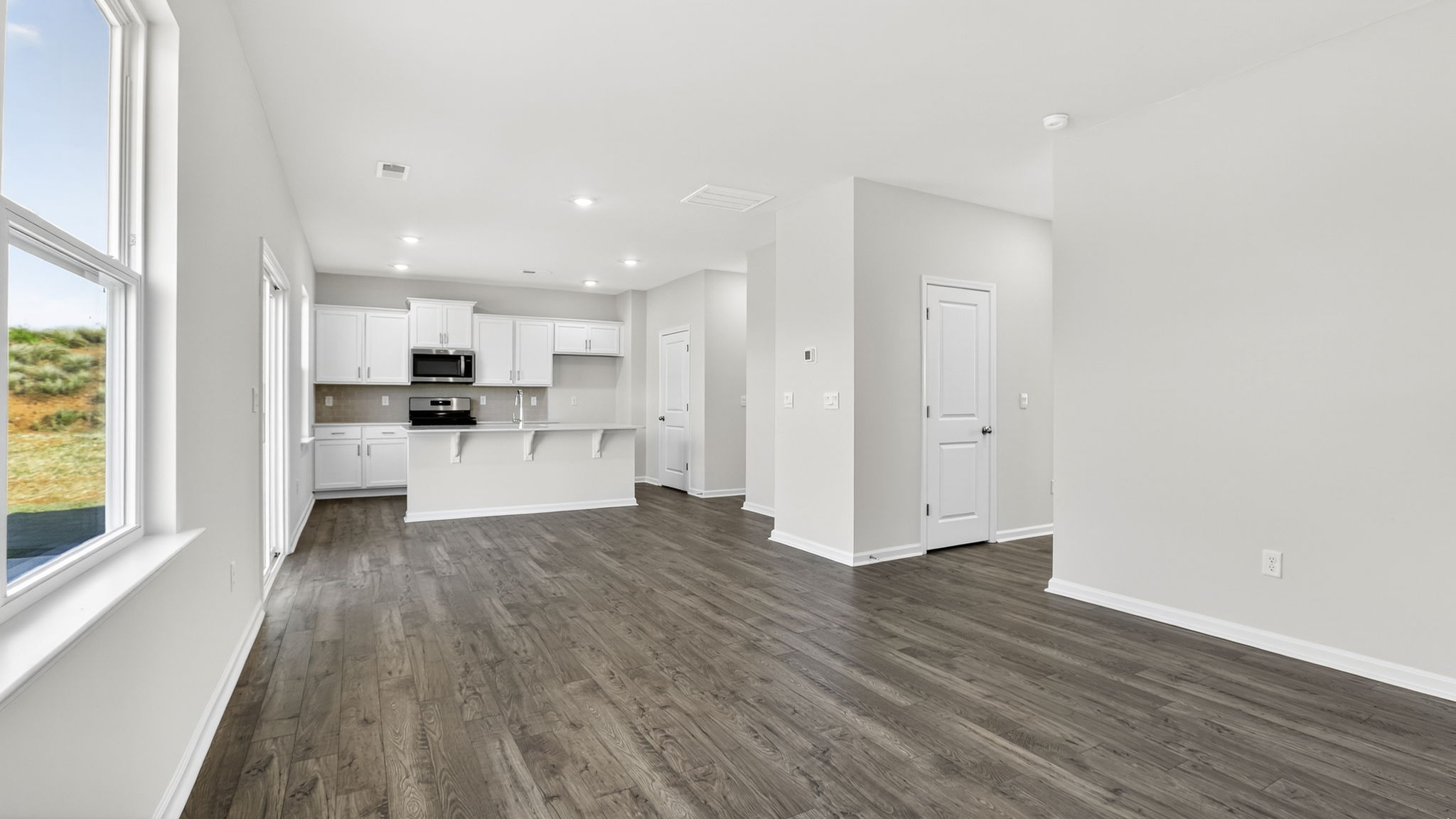 Family room with windows and fireplace.