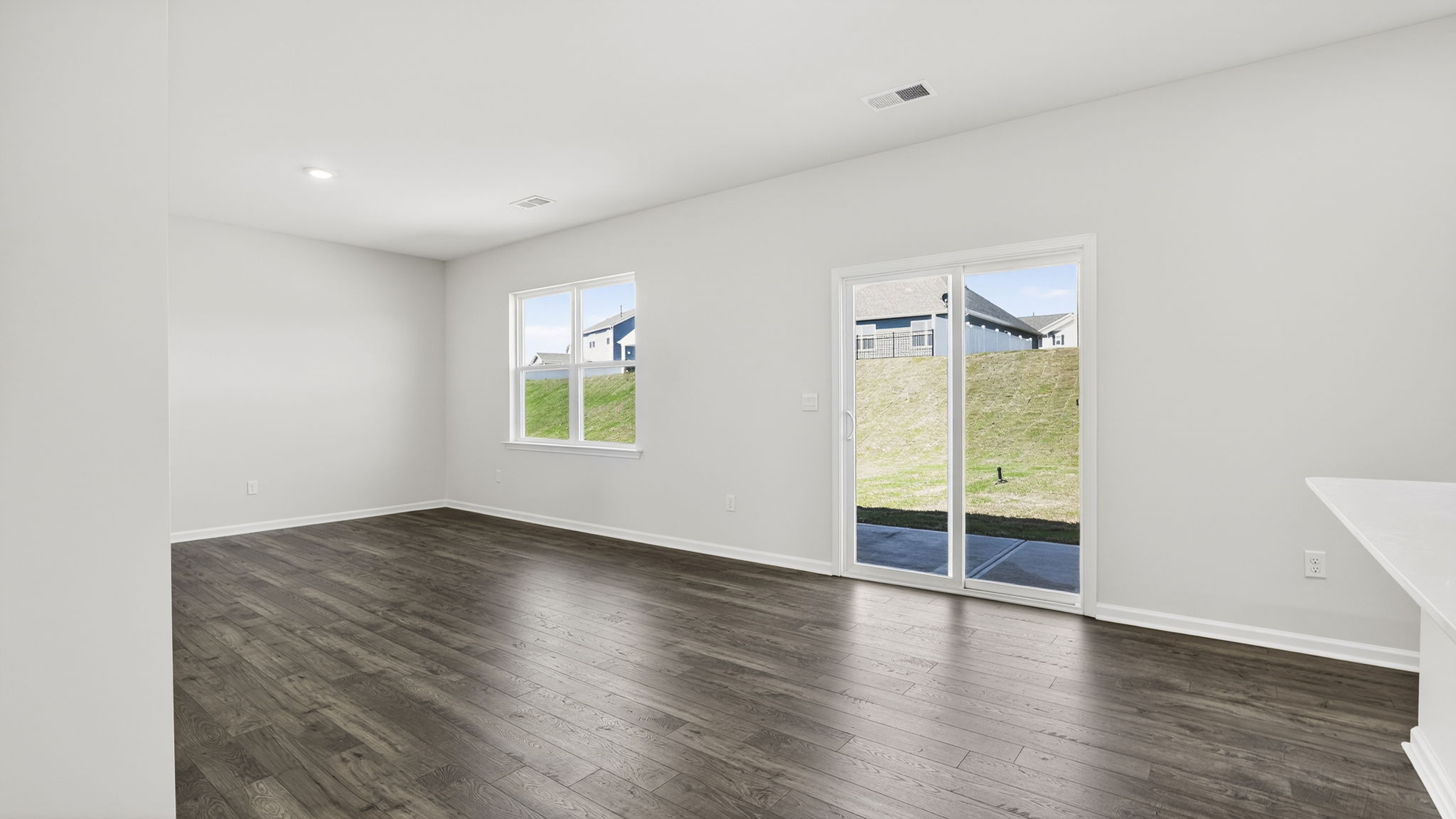 Family room with windows and fireplace.