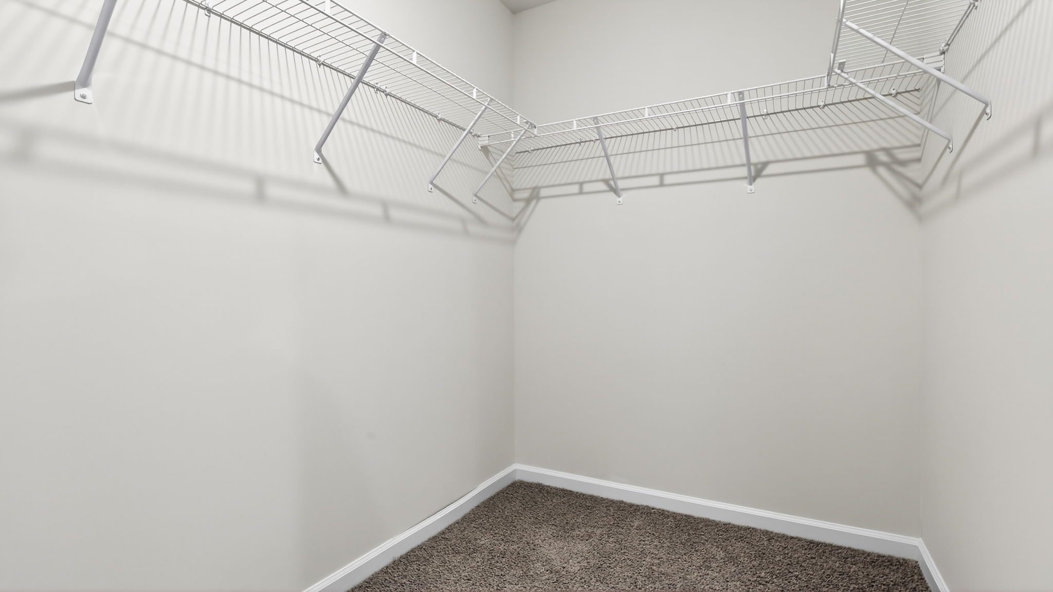 Closet with hanging storage racks.