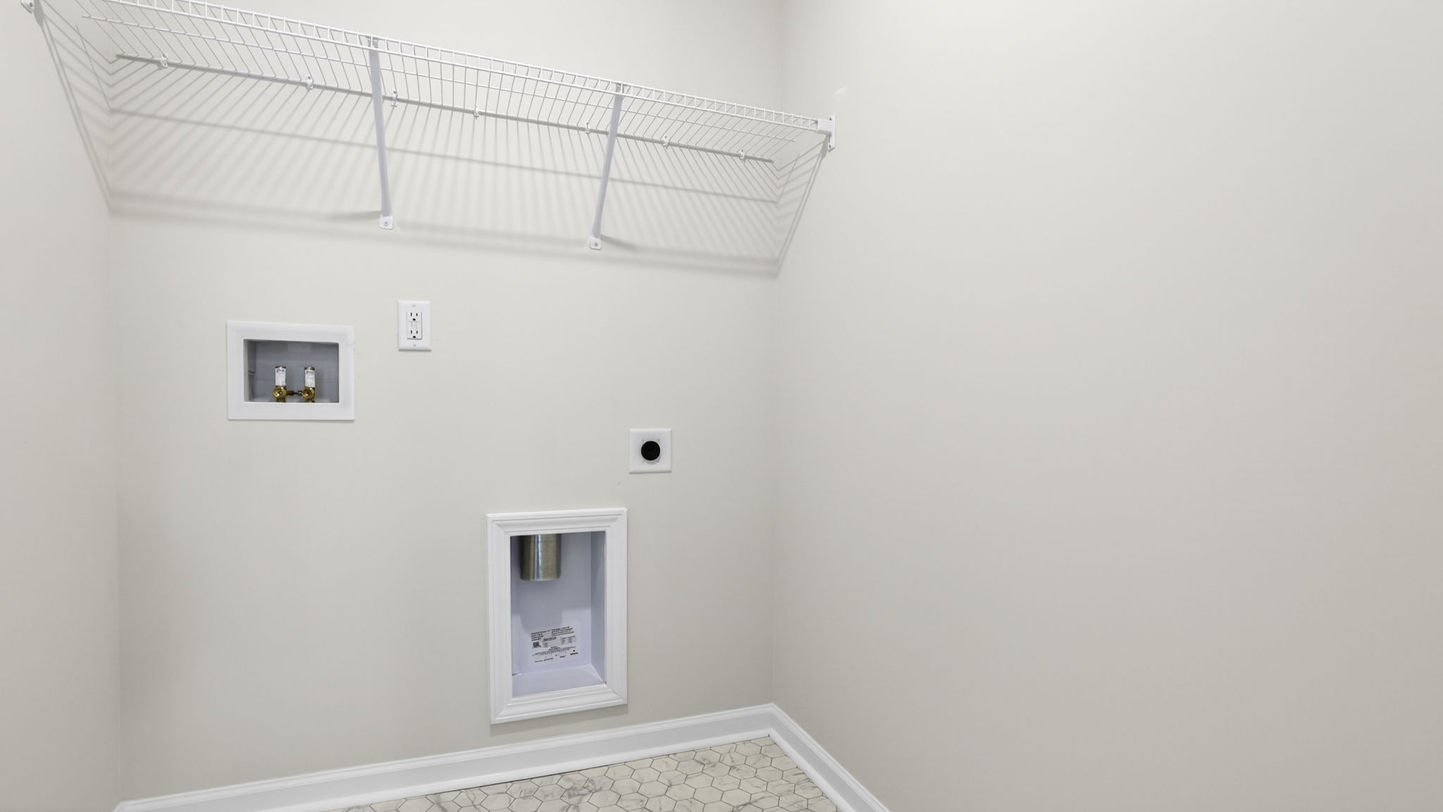 Laundry room with hanging storage racks.
