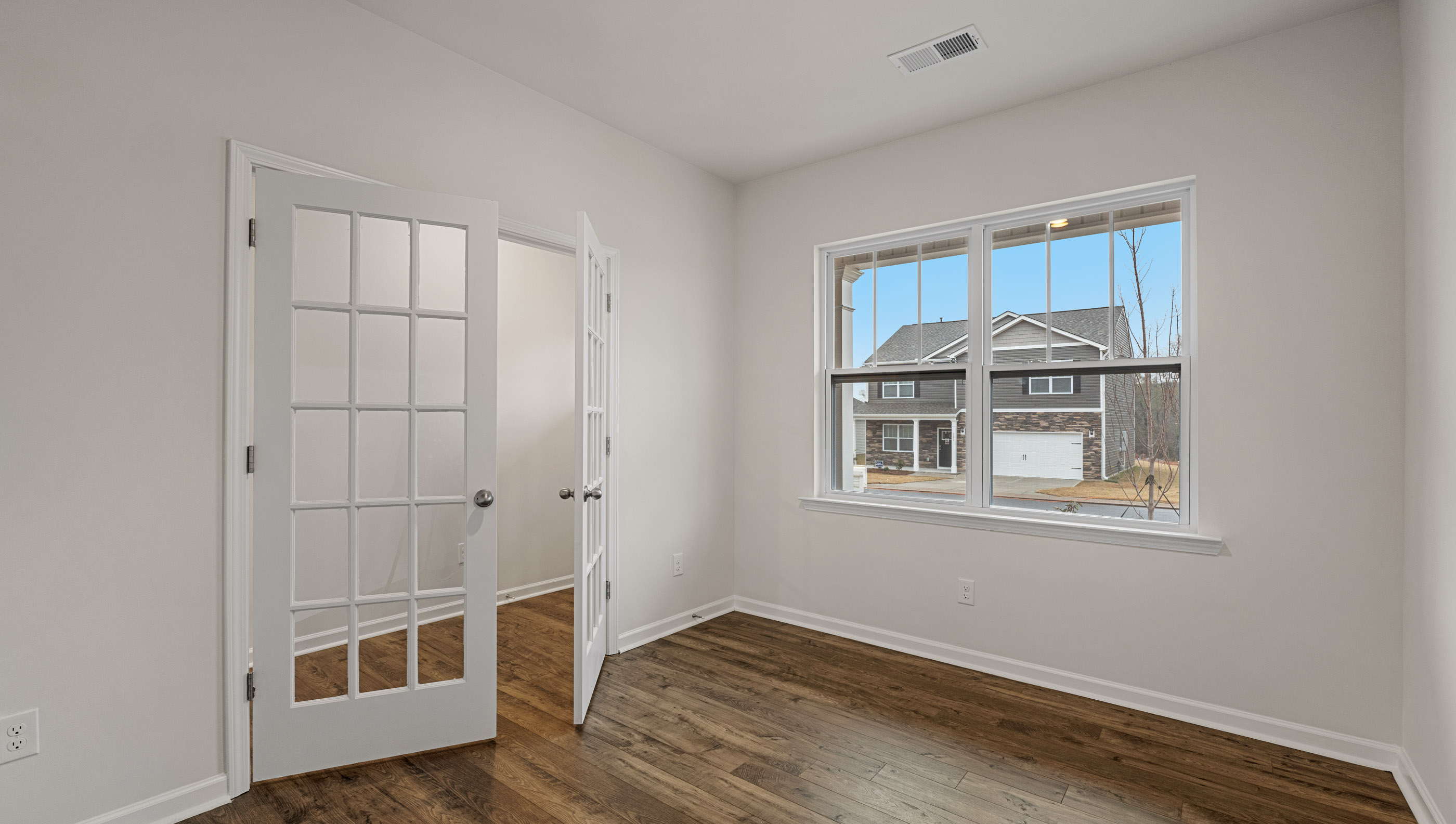 Flex room with french doors and window.