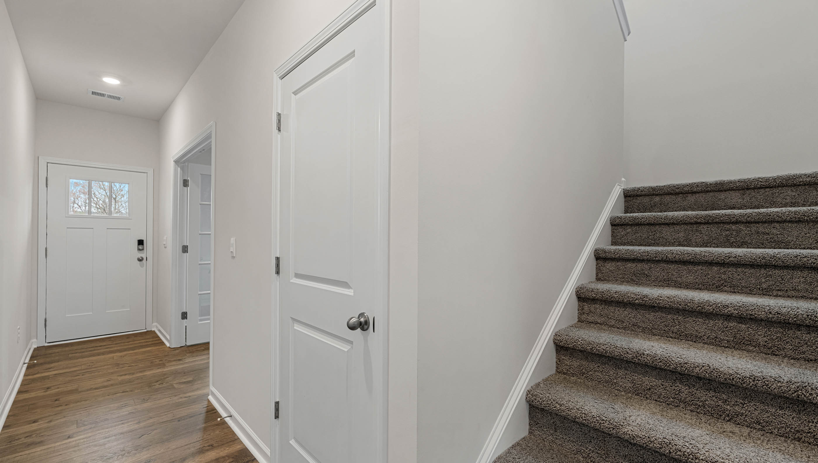 Foyer with staircase to upstairs.